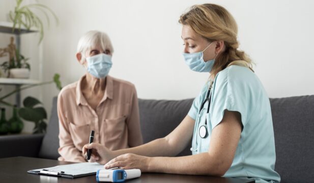 nurse-senior-woman-during-check-up-nursing-home